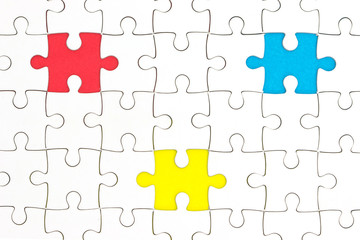 Jigsaw Puzzle with missing pieces in three different colors