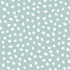 Seamless vector background with random white elements. Abstract ornament. Dotted abstract pattern