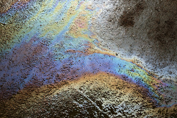 Background texture of an oil spill on road
