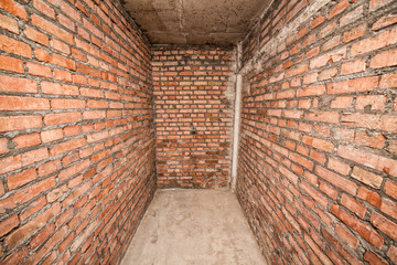 Room with brick walls.