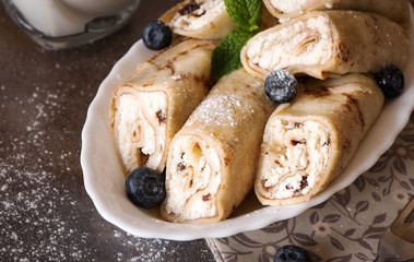 Crepes filled with cream cheese and raisin
