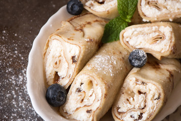 Crepes filled with cream cheese and raisin