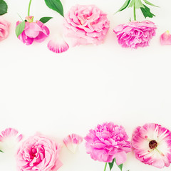 Frame of pink flowers and petals on white background. Floral lifestyle composition. Flat lay, top view.