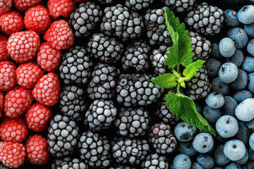 Assorted frozen berries background. Top view of background