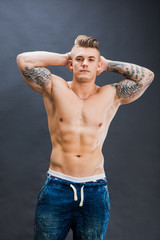 Young and healthy man topless show six pack abs