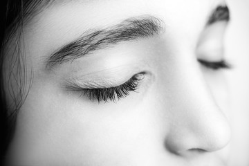 Obraz premium Close up image of a beautiful girl with her eyes closed