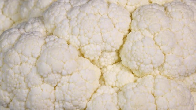 Amazing white side of cauliflower, rotating to the left. Vibrant natural texture close up in 4k, 3840x2160, clip. Eco product for healthy food.
