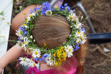 Wreath of daisies on the girl's head
