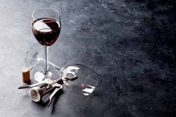 Red wine glasses and corkscrew