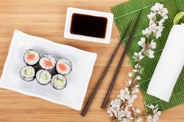 Sushi maki set with fresh sakura branch
