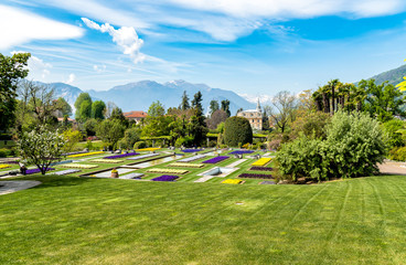 Landscape of Botanical Gardens of Villa Taranto with colorful flowers and palms, located on the...