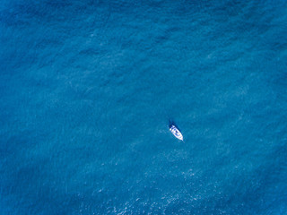Fisherman boat in the ocean drone shot