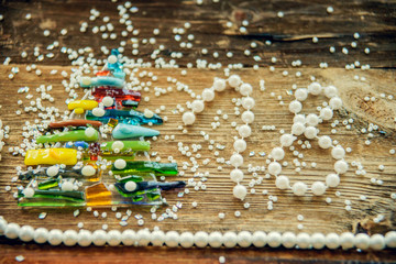 Christmas composition. Christmas gift, fir branches on wooden white background. Flat lay, top view