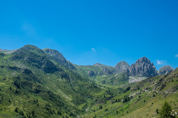 Mountain peaks meadows and forests in Grana Valley, Cuneo, Piedmont, Italy.