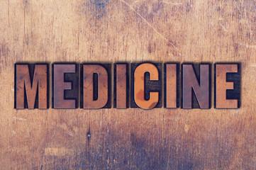 Medicine Theme Letterpress Word on Wood Background