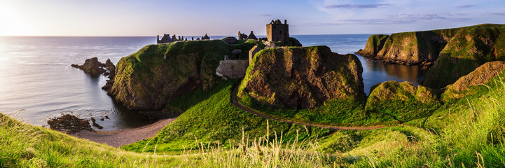 Panoramic view of Dunottar Castle at sunrise on the East Coast of Scotland. Aberdeenshire, United...