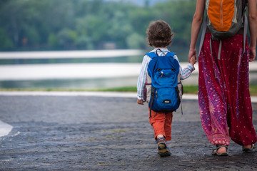 Fototapeta premium The child walks with his mother.