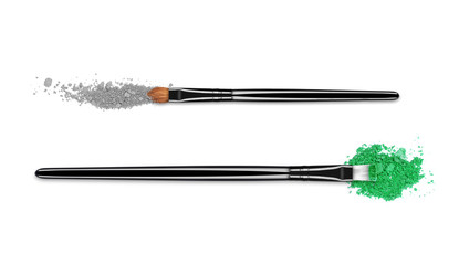 Crushed colored eyeshadows with brushes close-up, isolated on white background