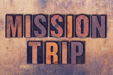 Mission Trip Theme Letterpress Word on Wood Background