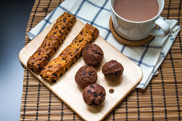 Chocolate chip stick bread with muffin on A cutting board
