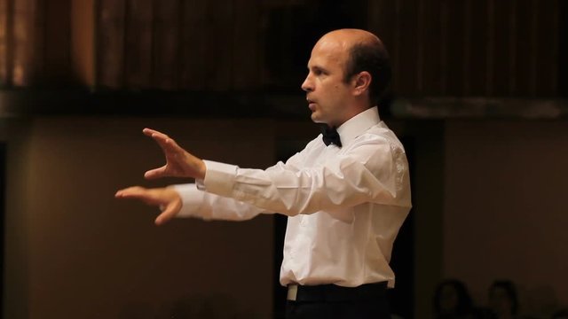 choir conductor during performance