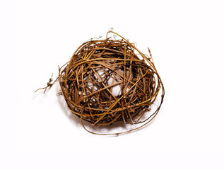 Ball of twigs on a white background