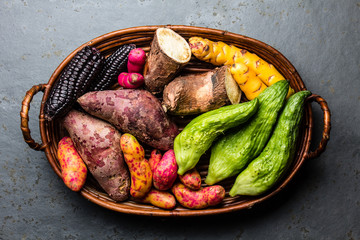 Fresh peruvian Latin American vegetables caigua, sweet potatoes, black corn, camote, yuca