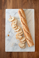 Bread baguette and marble board