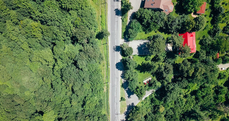 Fototapeta premium Aerial View Of Road Running Through Carpathian Mountains Forest