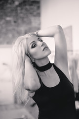 Elegant fashionable sensual blonde middle aged woman in black dress