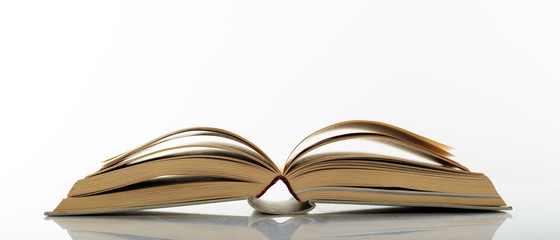 Vintage book open on white background