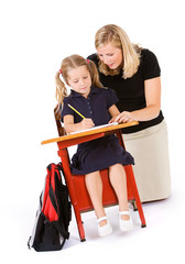 Student: Teacher Behind Student Helping With Homework