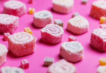 Assortment of Turkish Delight on pink background