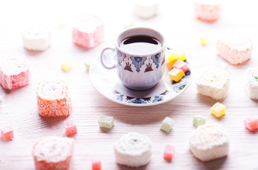 traditional oriental nougat with turkish coffee on a wicker tray
