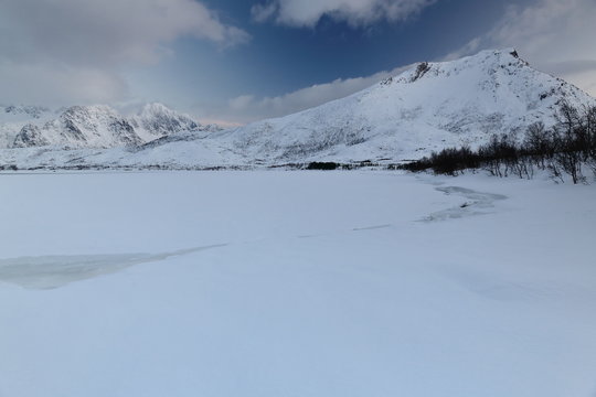 Frozen Vestpolltjonna bay-foot of Gronnfjellet mount. Austvagoya island-Nordland fylke-Norway. 0104