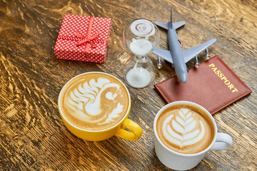 Coffee, present and hourglass. Passport and toy plane. How to get visa faster.