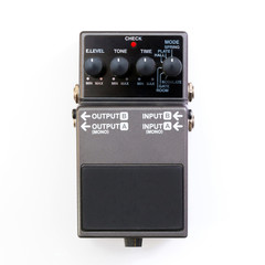 Fototapeta premium Guitar pedal. Top view of a guitar effect pedal on white background.