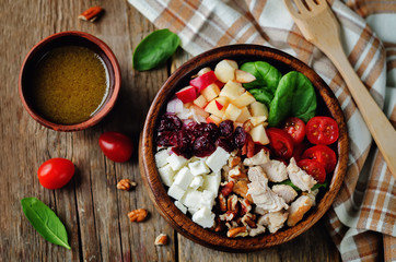 Chicken spinach apple tomato goat cheese salad