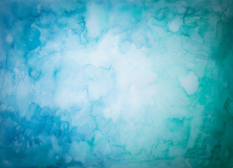Blauer und Grüner Hintergrund aus Aquarellfarben  mit abstraktem fleckigen Muster und heller Mitte
