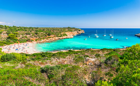 Cala Varques beautiful beach Majorca island, bay with tropical ocean water and sailboats, Spain Mediterranean Sea, Balearic Islands