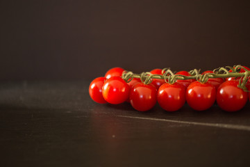 Fresh tomatoes on a black background