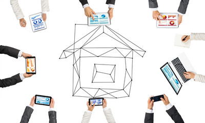 Top view of businesspeople sitting at table and using gadgets