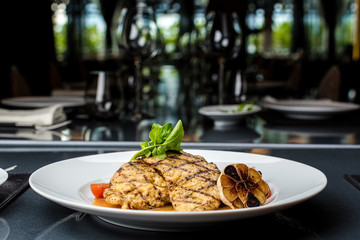 Grilled chicken fillet with french fries and asparagus