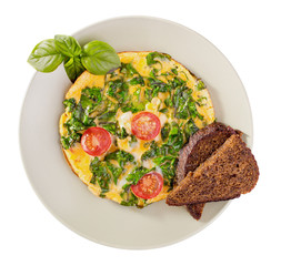 Scrambled eggs with kale and toast isolated on white top view