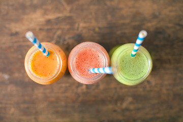 Fresh Juices Smoothie Three Jar made Red Green Orange Fruits Water Melon Strawberry Apple Kiwi Grapes Pomegranate Passion Dragon Fruit Tropical Selective focus