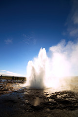 Strokkur Geysir Eruption against the Sun, Iceland
