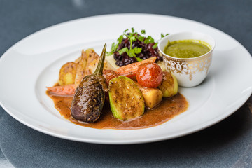 Steamed vegetables with mashed potatoes and sauce
