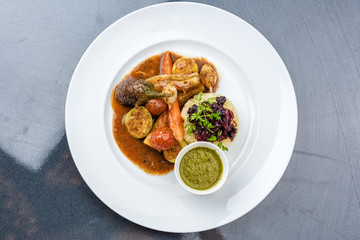 Steamed vegetables with mashed potatoes and sauce