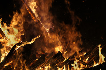 Flame of fire with sparks on a black background