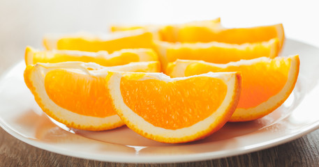 Naklejka na ściany i meble fresh orange slices on a plate